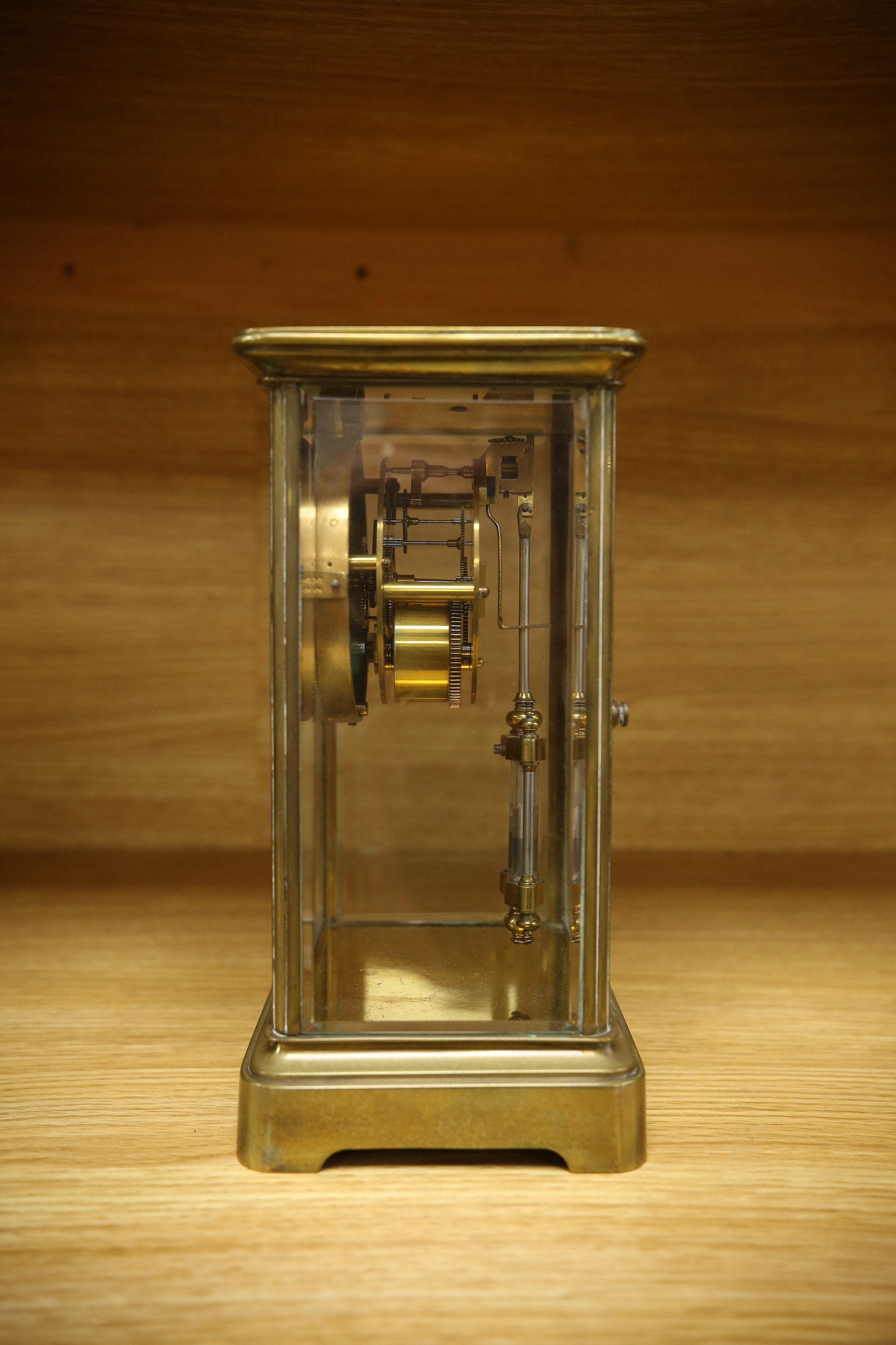 An early 20th century brass four glass mantel clock, 22cm. Condition - fair, not tested as working